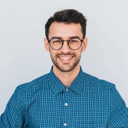 Closeup portrait of handsome smart-looking smiling with toothy smile male posing for social advertisement, isolated on white background with copy space for your promotional information or content.